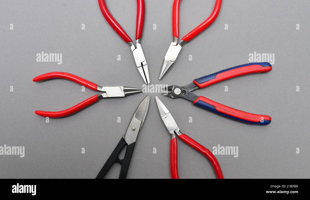 many types of pliers electrician tools equipment background Stock Photo