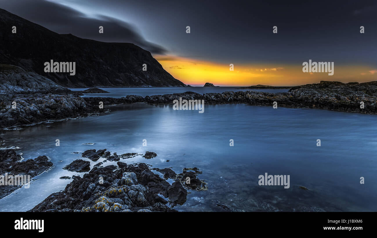 Rocky shore sunset Stock Photo - Alamy