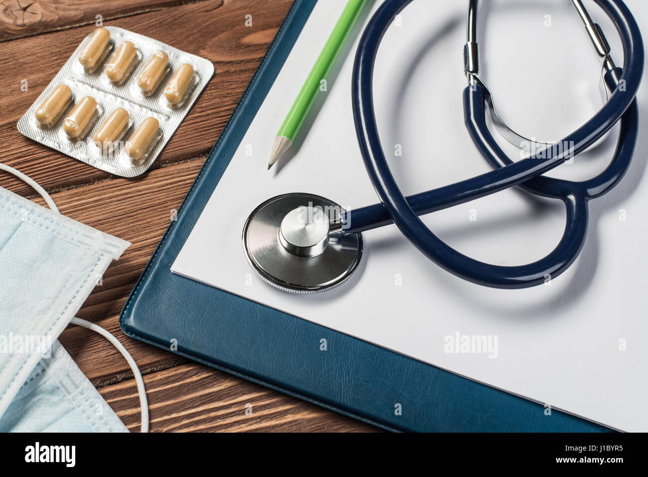 Desk of doctor with medicine things Stock Photo - Alamy