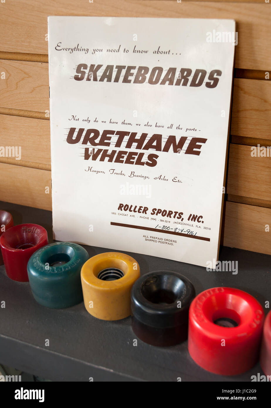 Roller Sports Inc. book of 'Everything you need to know about skateboards' and vintage urethane skateboard wheels at Morro Bay Skateboarding Museum Stock Photo