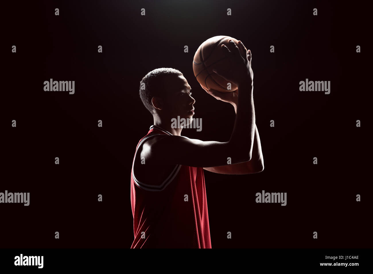 African american player throwing basketball hi-res stock photography ...