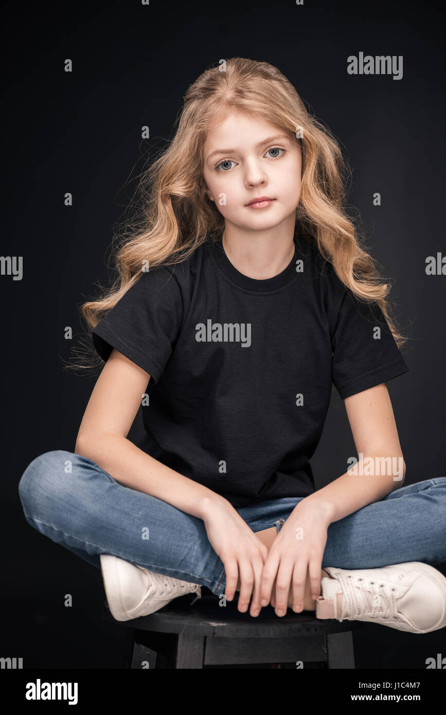 Girl sitting on stool hi-res stock photography and images - Alamy