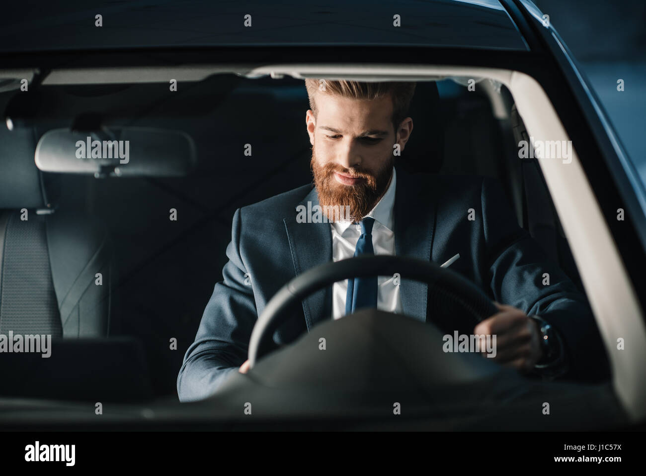 Young businessman steering wheel hi-res stock photography and images ...