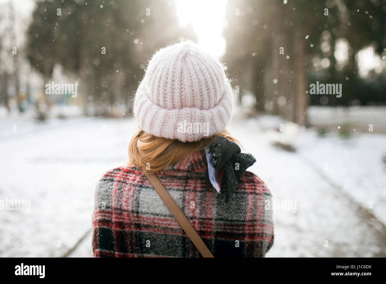 Rear view of Caucasian woman outdoors in snow Stock Photo - Alamy