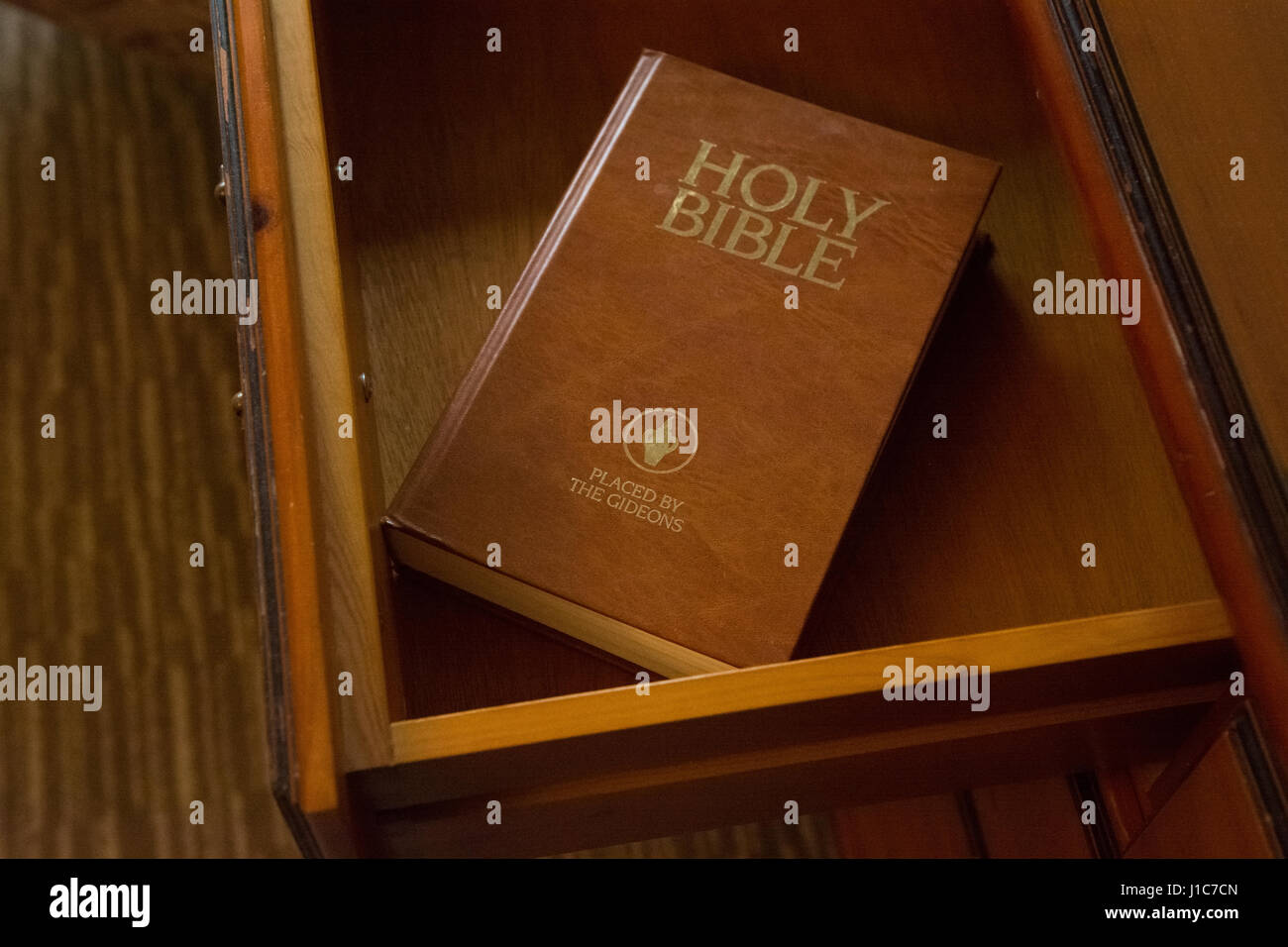 Gideons bible in hotel room bedside drawer Stock Photo