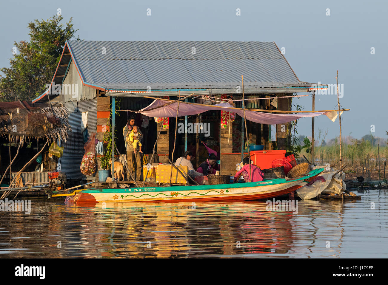 Family life, Floating houses along the Sangker river, Prek Toal, Cambodia Stock Photo