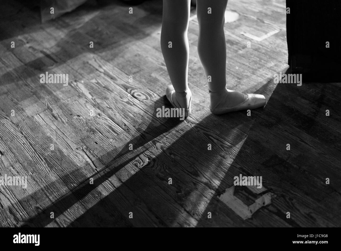 Legs of woman wearing ballet shoes Stock Photo