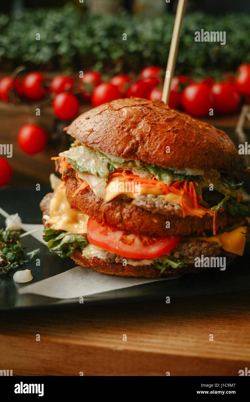 Gourmet cheeseburger on plate Stock Photo