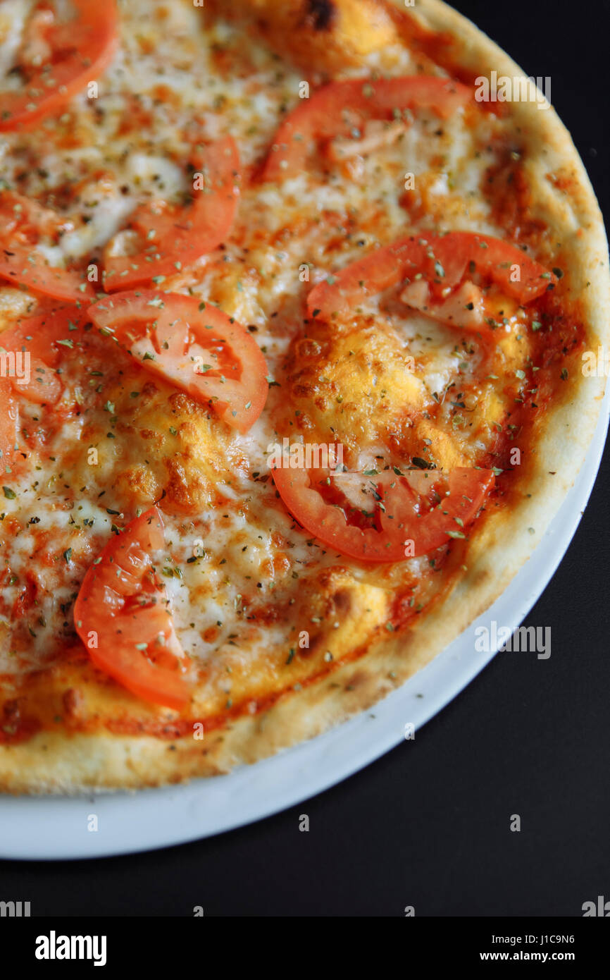 Gourmet pizza with tomatoes Stock Photo