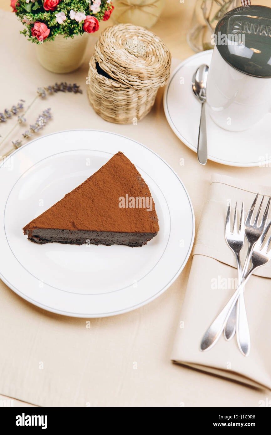 Slice of chocolate cake on plate Stock Photo