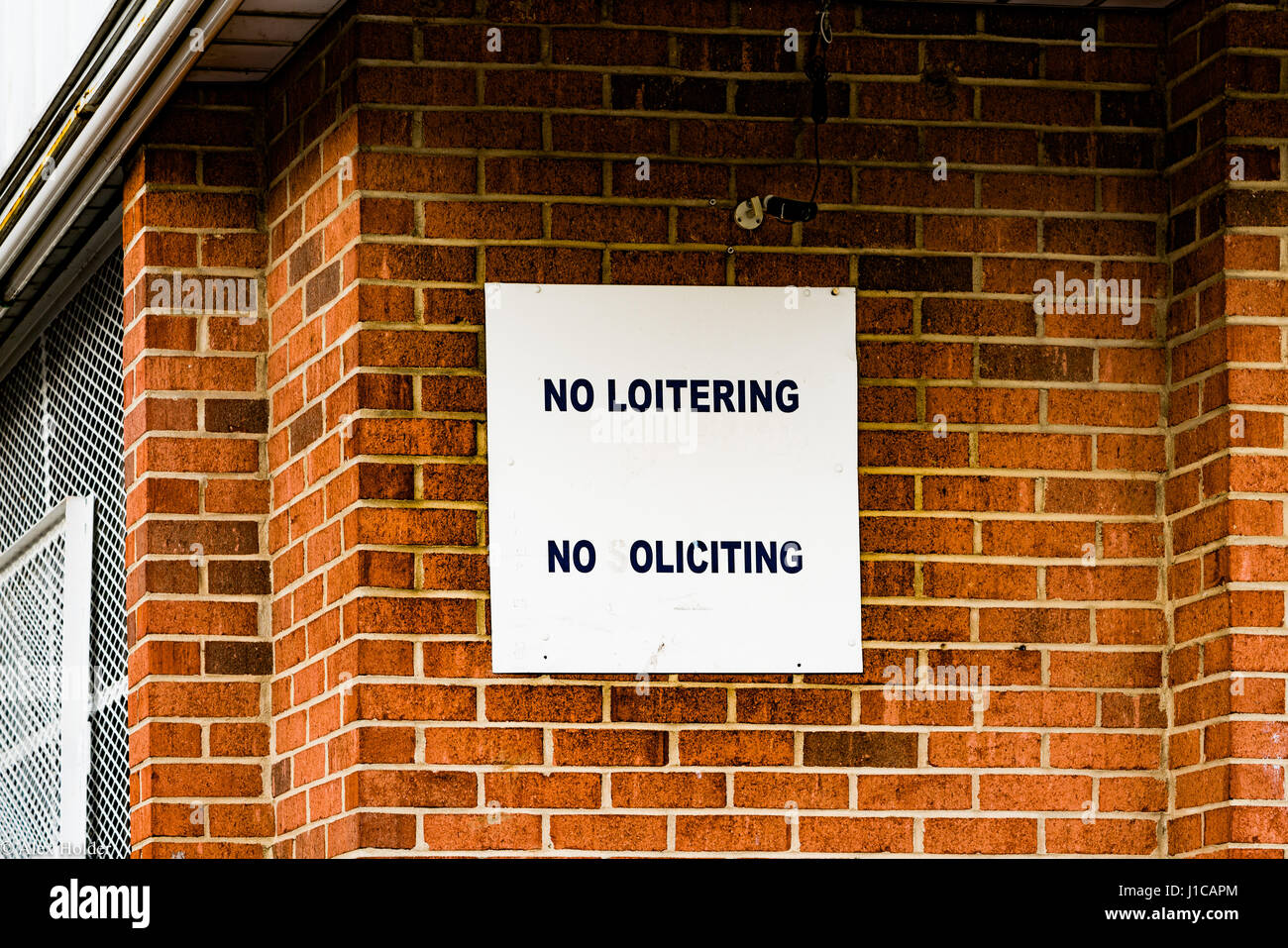No loitering sign on outside of store Stock Photo