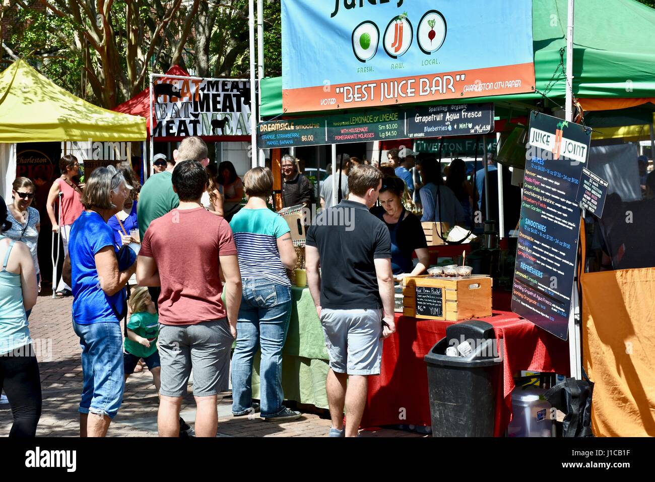 Customers standing in line for the Juice Joint stand at the Charleston farmers market Stock Photo