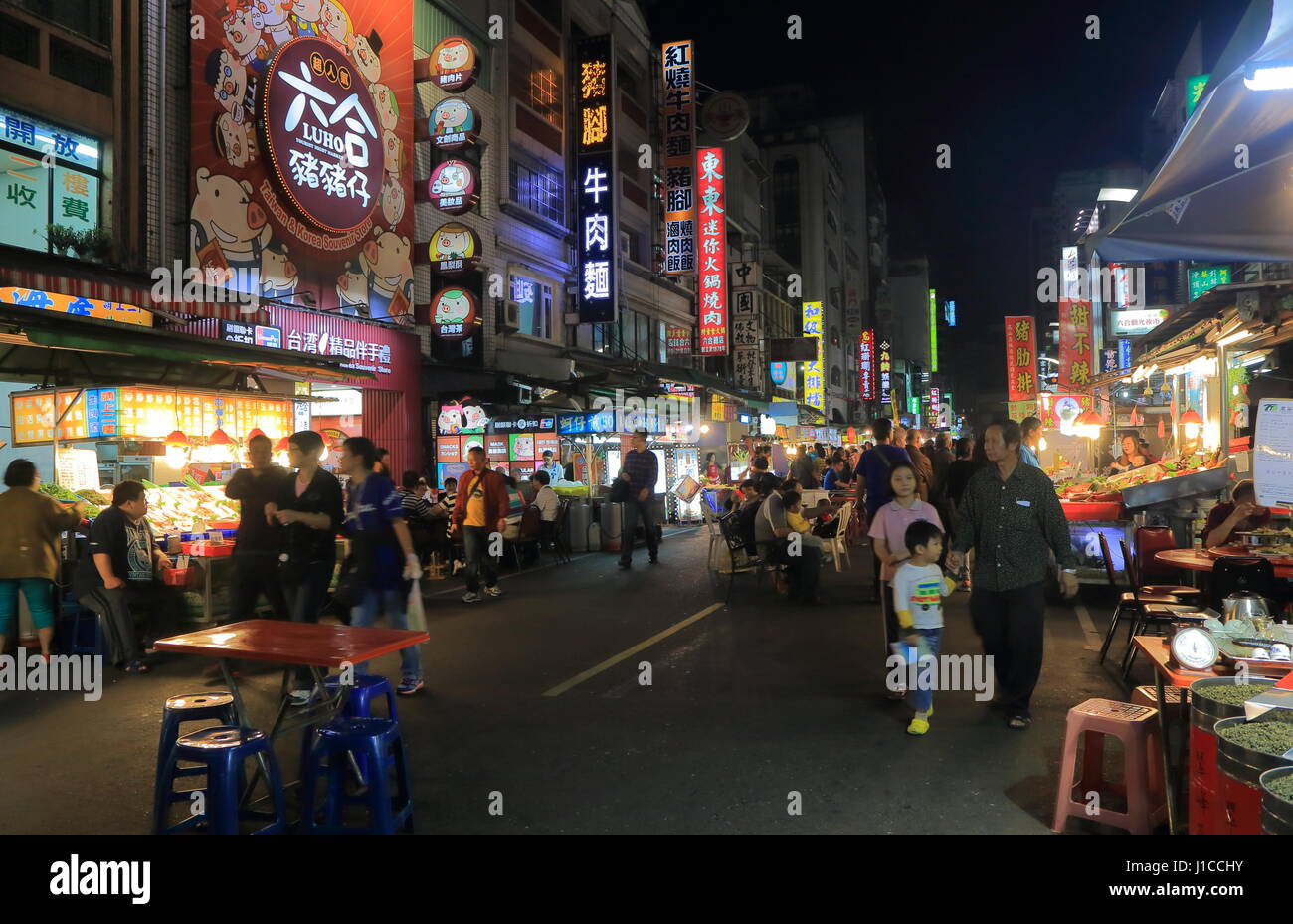 People visit Liuhe night street market in Kaohsiung Taiwan. Liuhe market is one of the most popular markets in Taiwan. Stock Photo