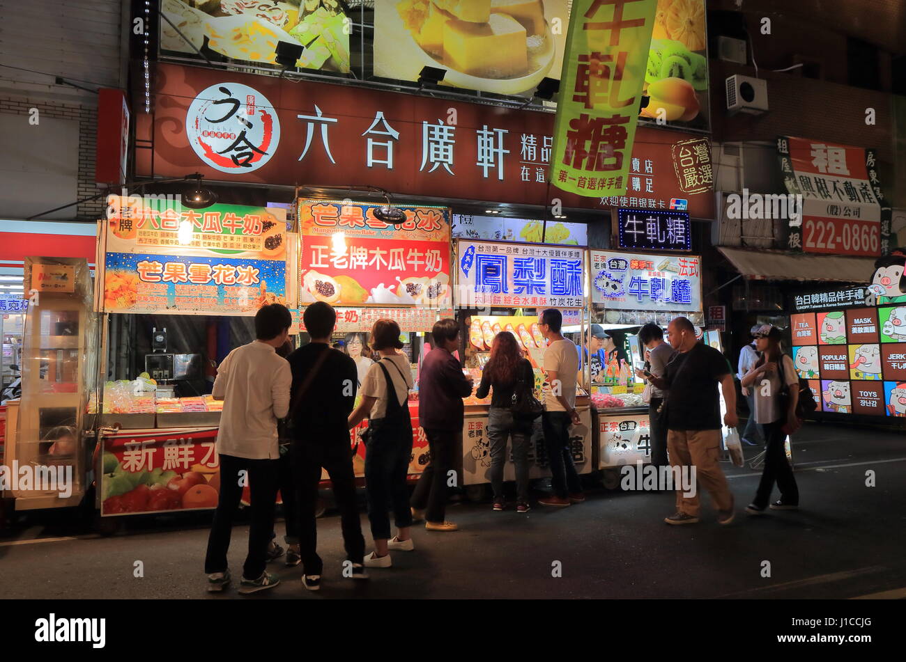 People visit Liuhe night street market in Kaohsiung Taiwan. Liuhe market is one of the most popular markets in Taiwan. Stock Photo