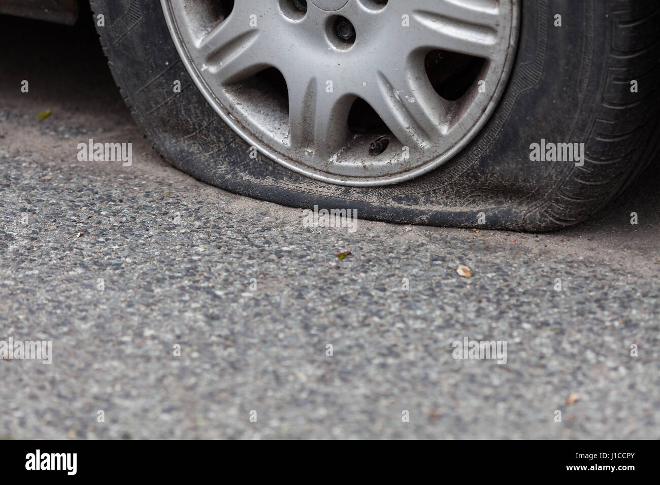 Flat tire on the road Stock Photo Alamy