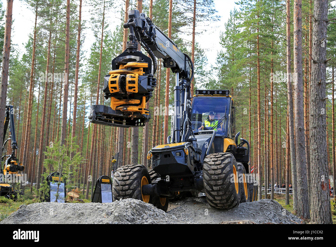 JAMSA, FINLAND - SEPTEMBER 1, 2016: Ponsse forest harvester Ergo and harvester head presented during a ride over rough terrain, a work demonstration b Stock Photo