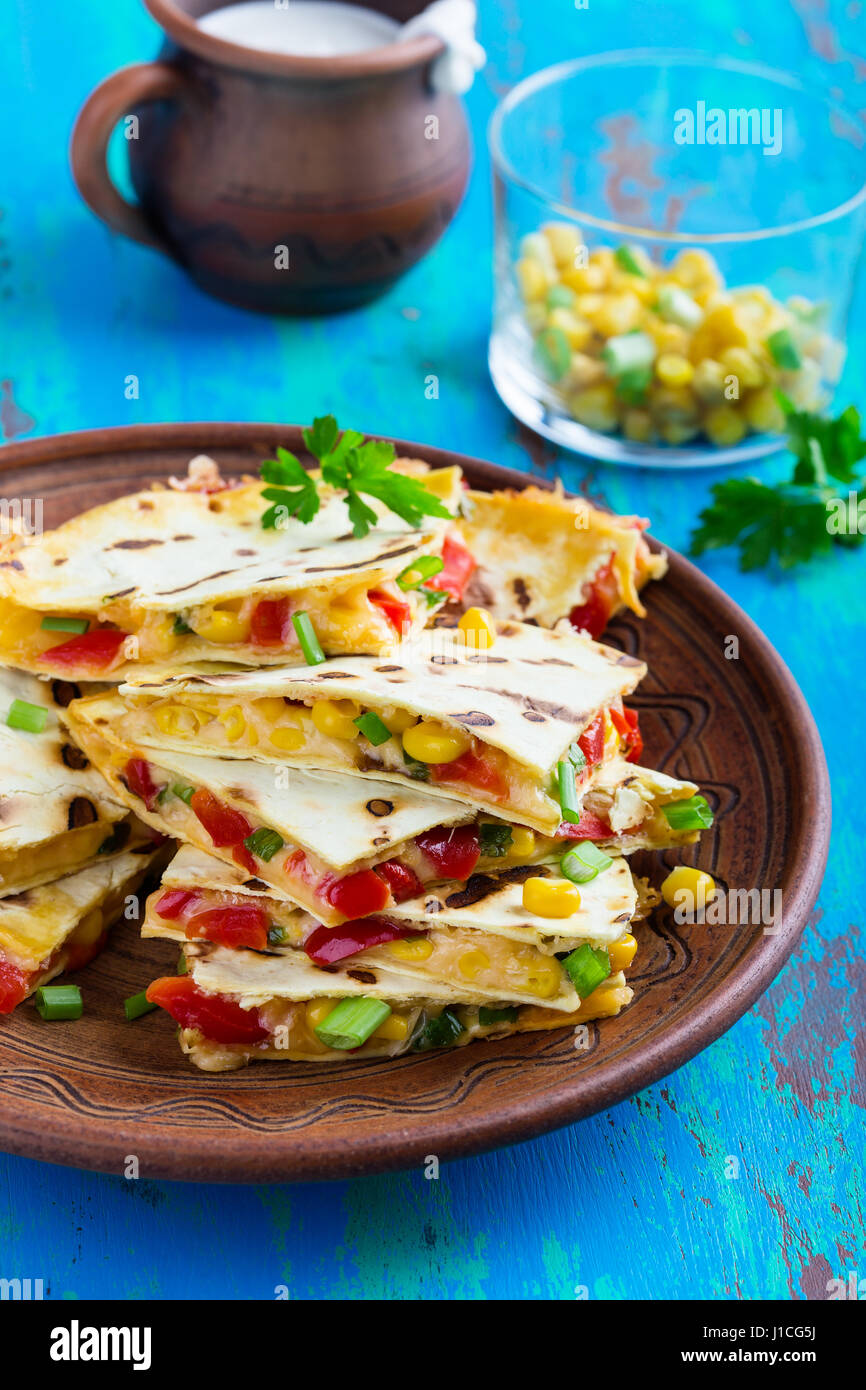 Fresh grilled red bell pepper quesadillas with corn served cut into