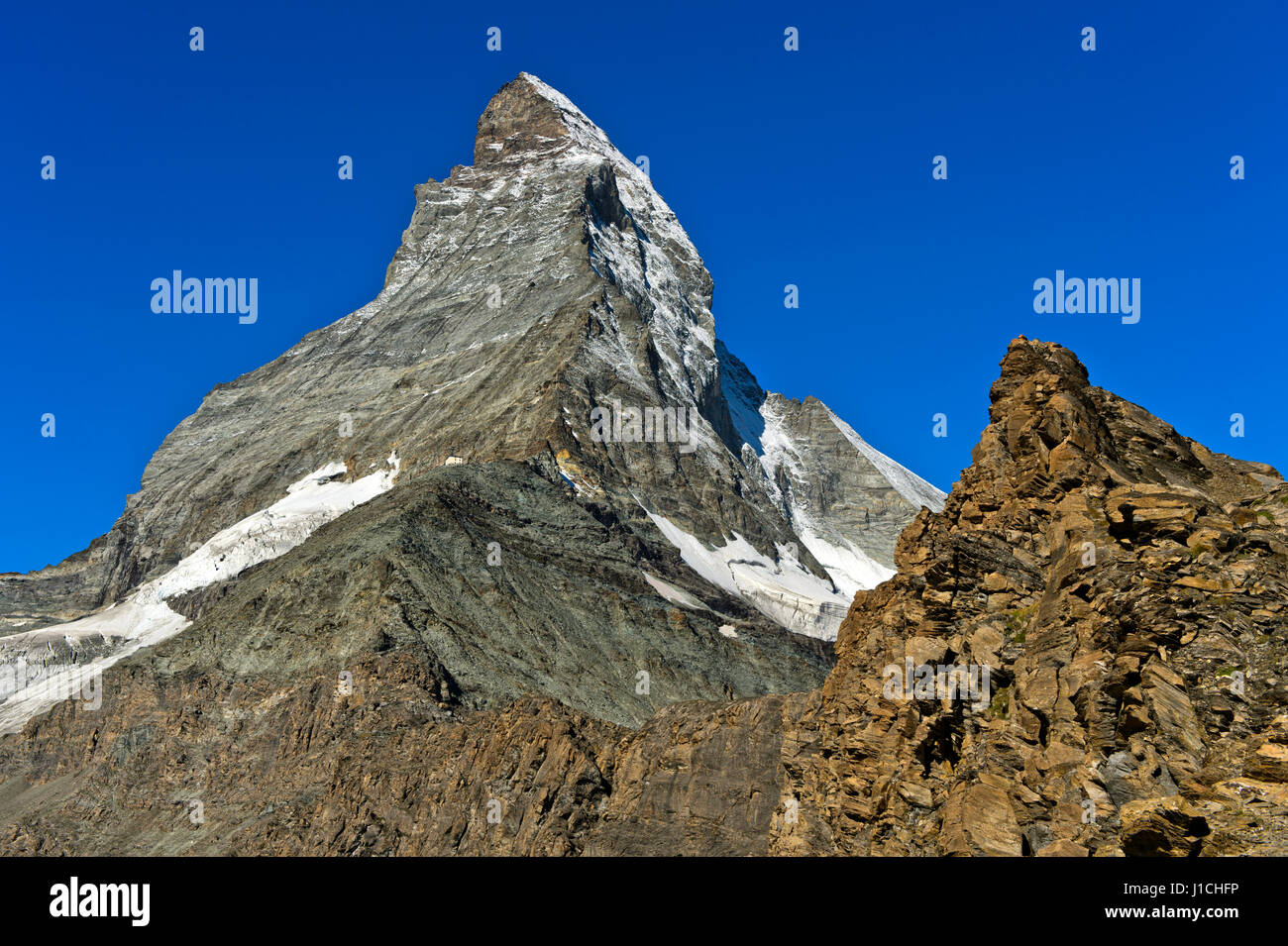 Mountain hut Hoernlihuette and Hoernli ridge at the Matterhorn peak, Zermatt, Valais, Switzerland Stock Photo