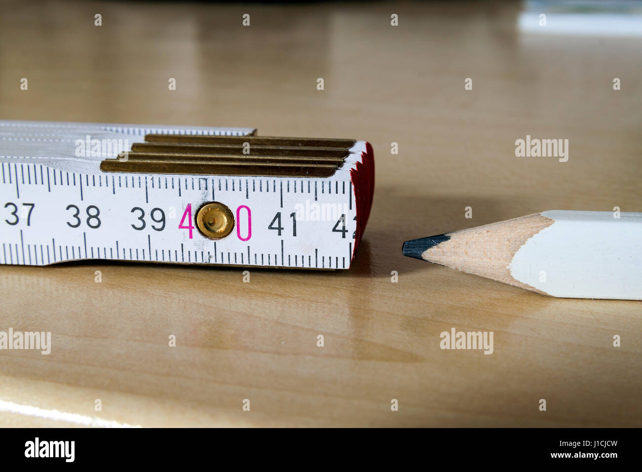 Measuring tape meter and pensil. Construction tools. Stock Photo