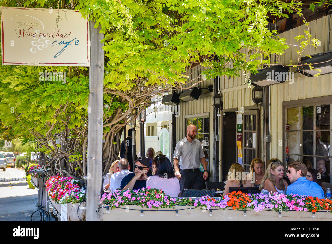 People enjoy the outdoor patio dining at the Los Olivos Wine merchant