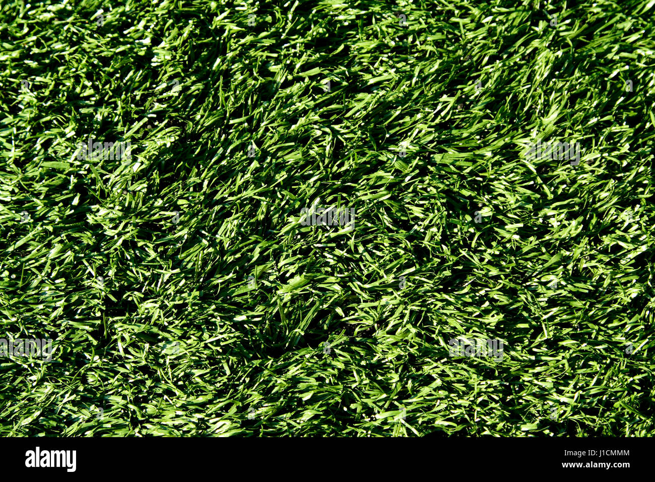 A shot of a green artificial turf on a football field Stock Photo - Alamy