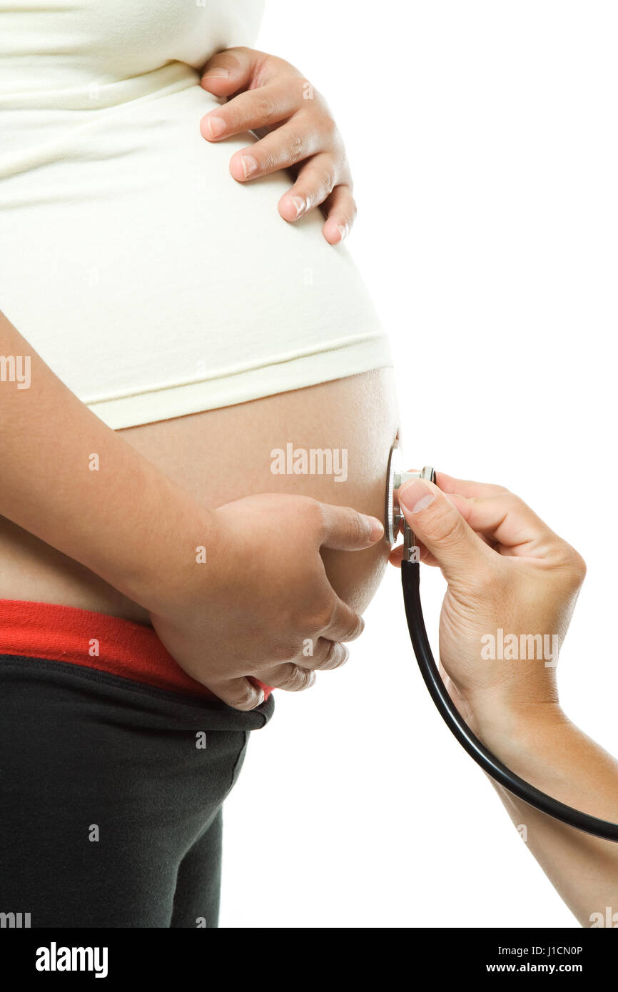 An isolated shot of a pregnant woman being examined by a doctor Stock Photo