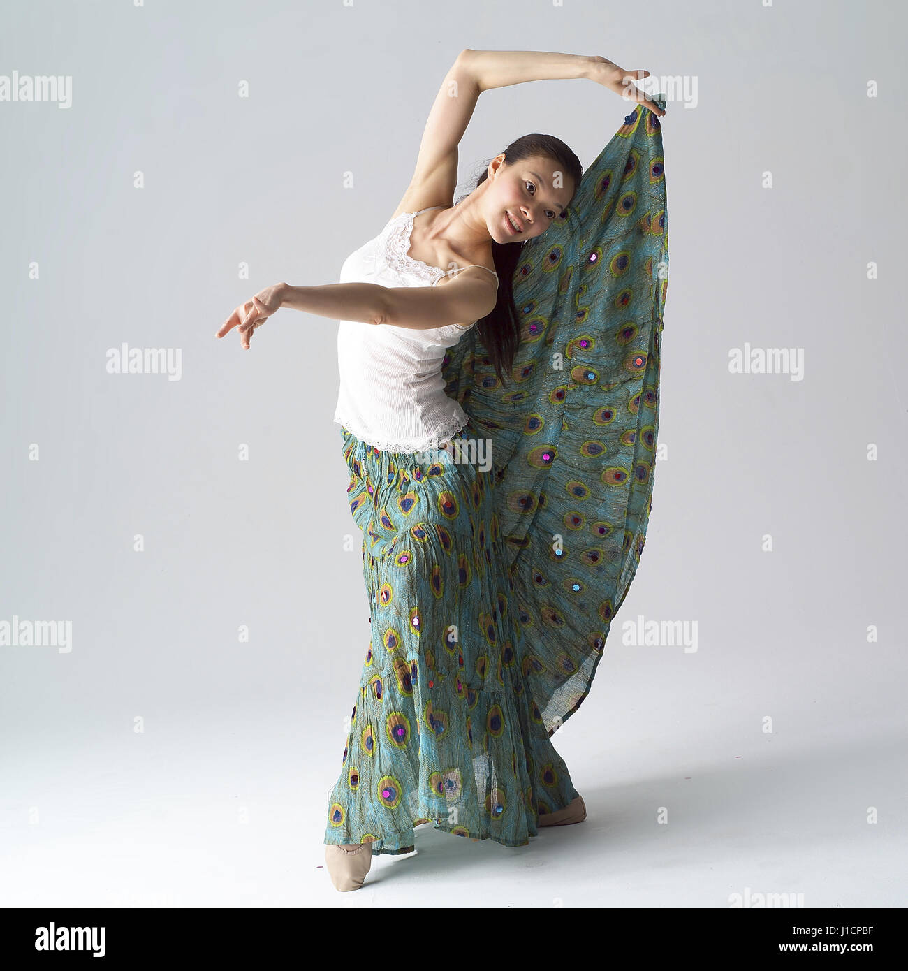 One woman dancing holding skirt hi-res stock photography and images - Alamy