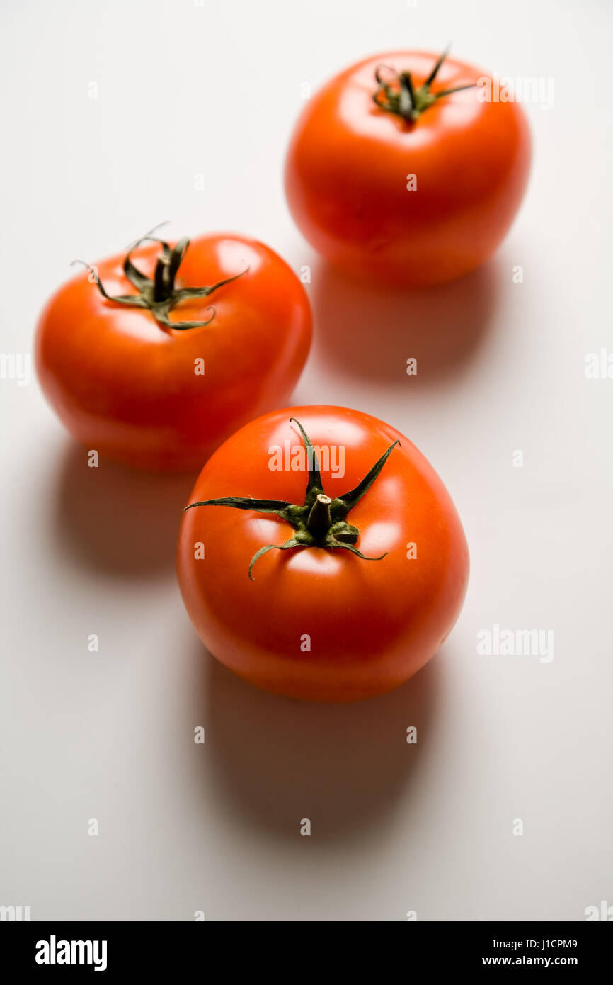 A shot of three ripe and juicy tomatoes Stock Photo - Alamy
