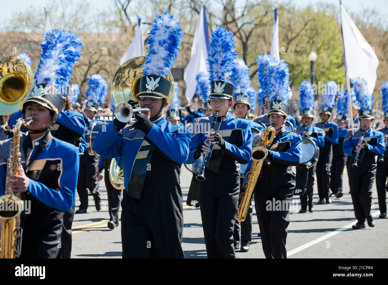 High school marching band participating in street parade - USA Stock Photo