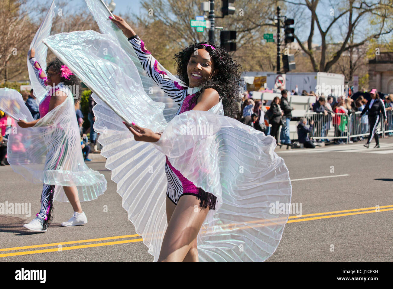 Black high school cheerleader during parade - USA Stock Photo