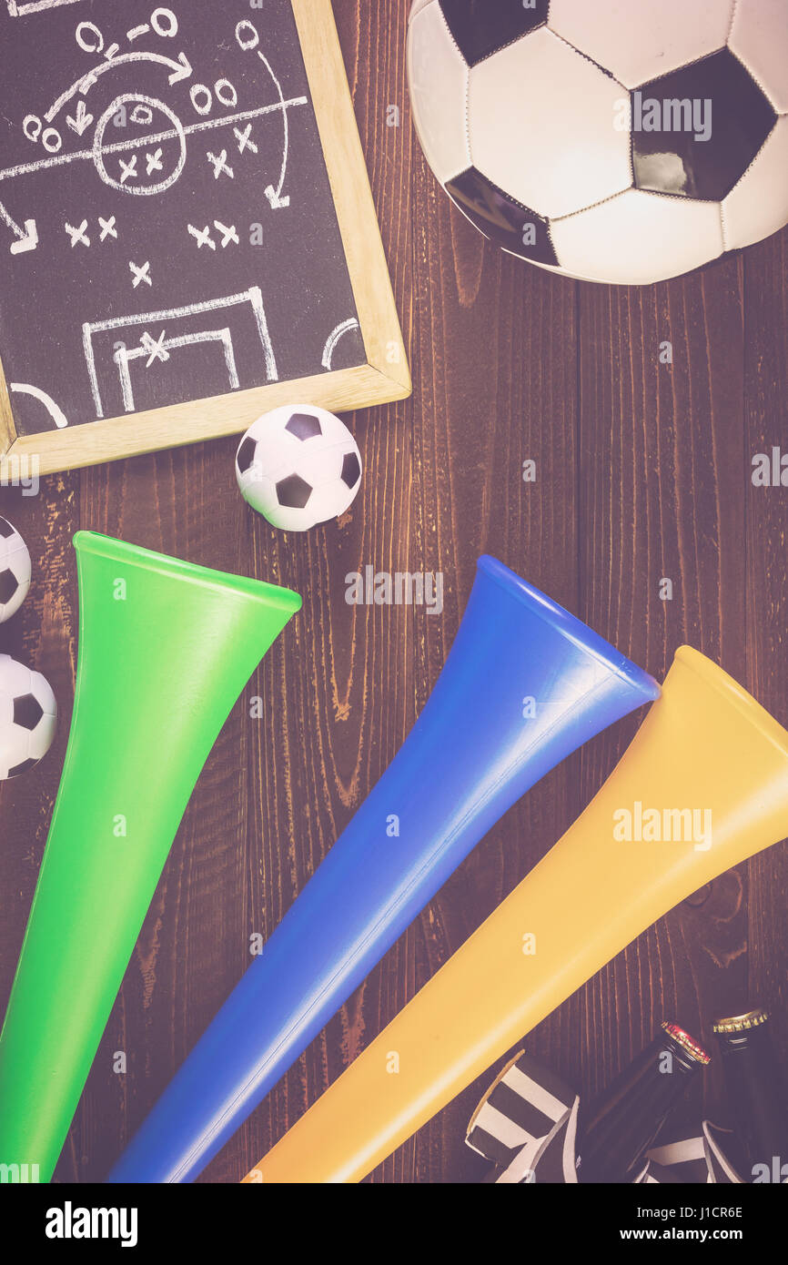 Soccer ball and Vuvuzela stadium horns on a wood background Stock Photo ...