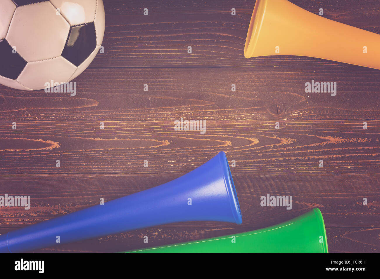 Soccer ball and Vuvuzela stadium horns on a wood background Stock Photo ...
