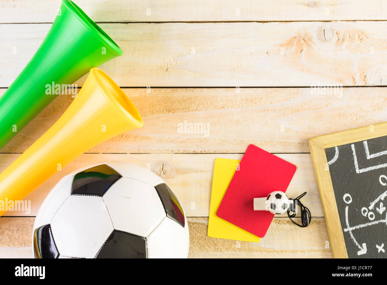 Soccer ball and Vuvuzela stadium horns on a wood background Stock Photo ...