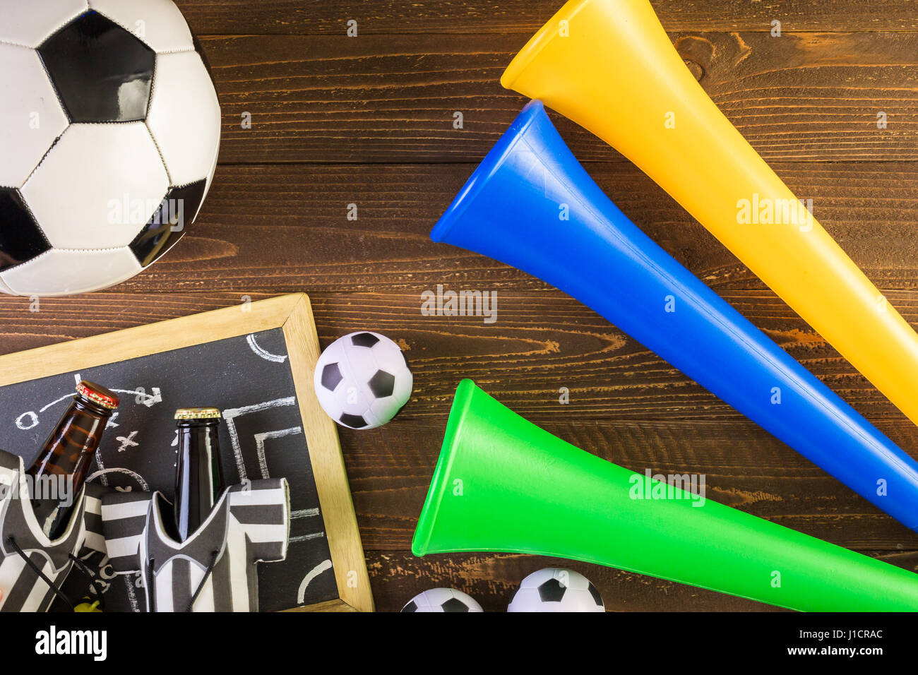 Soccer ball and Vuvuzela stadium horns on a wood background Stock Photo ...