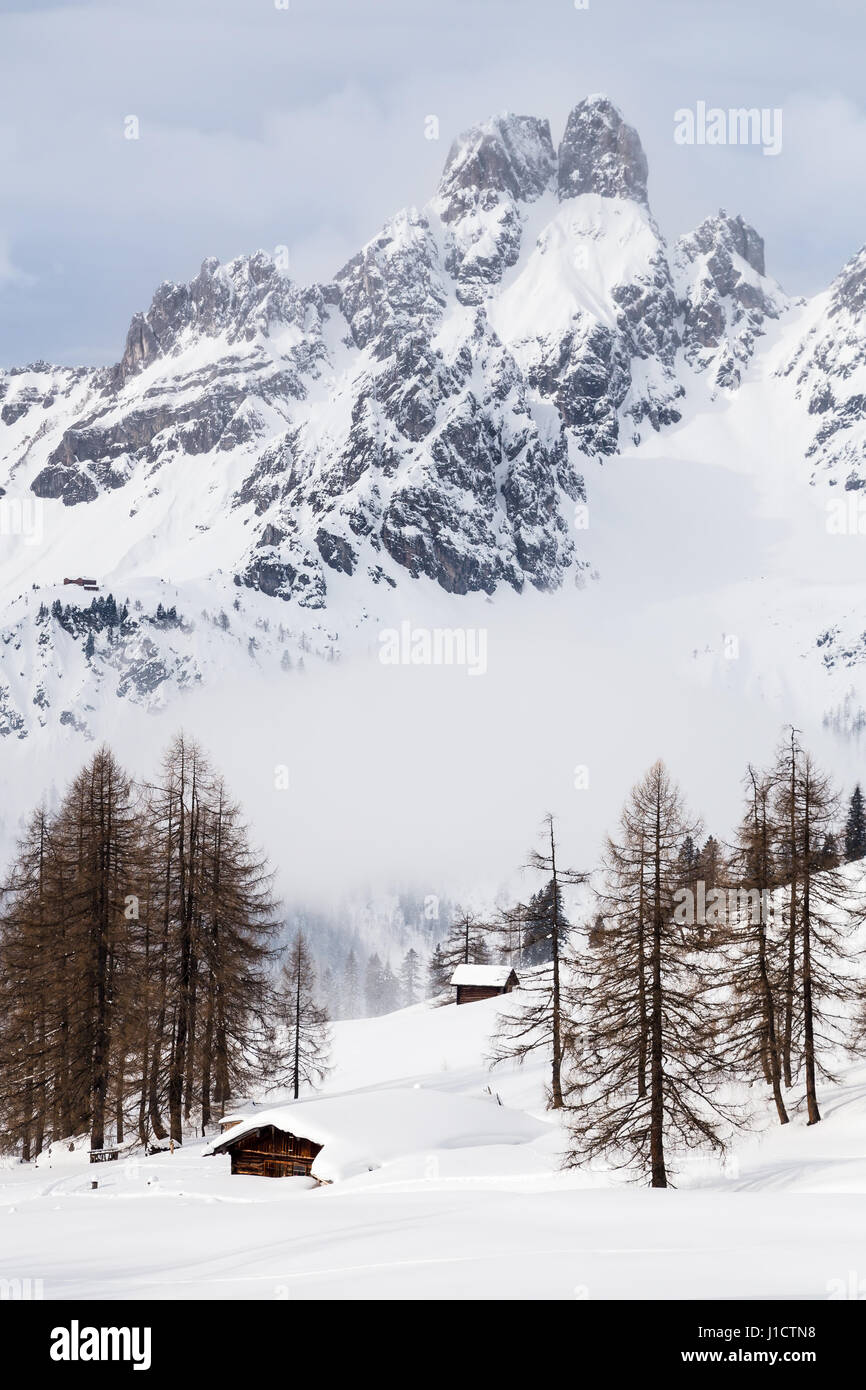 Log Cabins In A Winter Landscape In The Austrian Alps Stock Photo