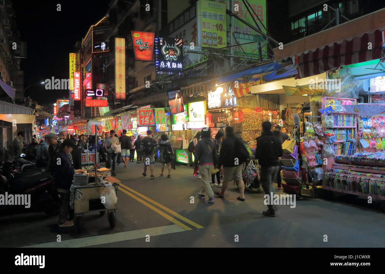People visit Yizhong street night market in Taichung Taiwan Stock Photo