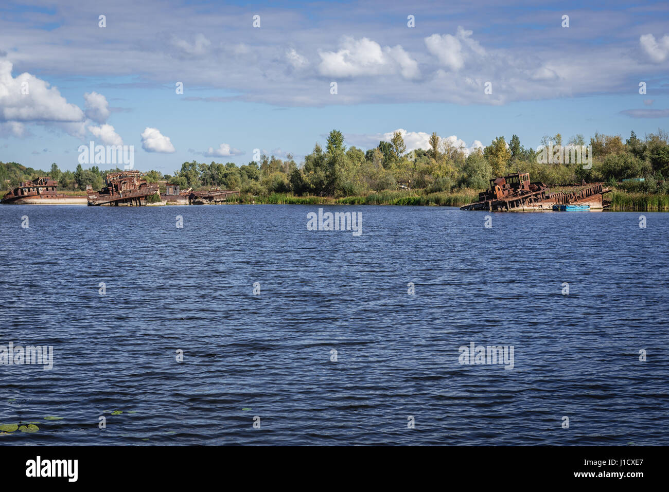 Ship wrecks around bank of backwater of Pripyat River in Chernobyl town, Chernobyl Nuclear Power Plant Zone of Alienation, Ukraine Stock Photo