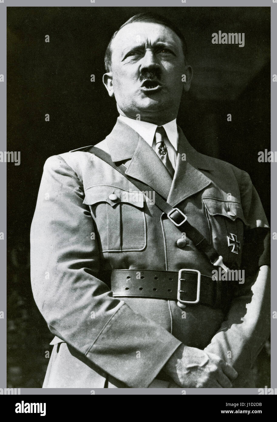 Adolf Hitler in uniform wearing a self awarded Iron Cross medal making a speech to a rally of Hitler Youth at Nuremberg Germany 1934 Stock Photo