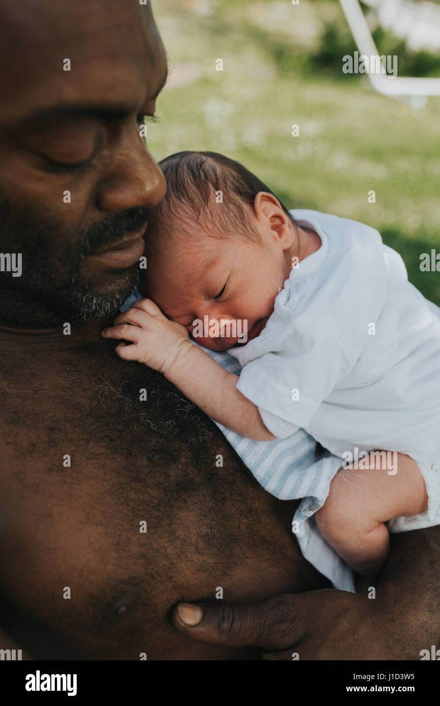 father with baby son in his arms Stock Photo