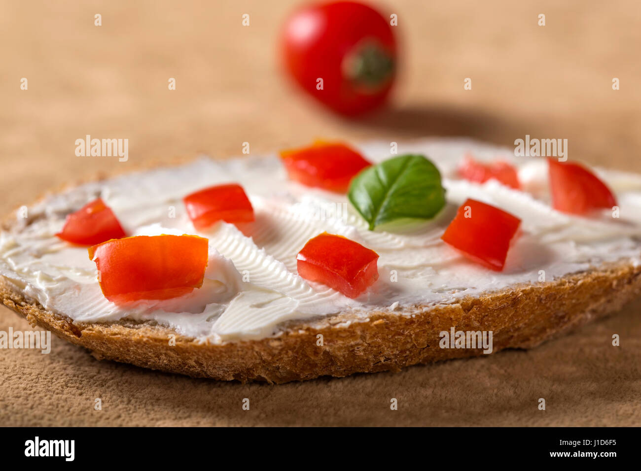 Open sandwich with cheese cream and red bell pepper Stock Photo