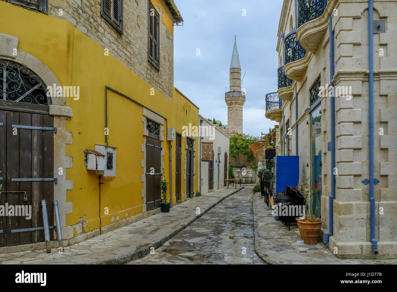 Mosque with minaret in  street scene in old town Limassol. Stock Photo