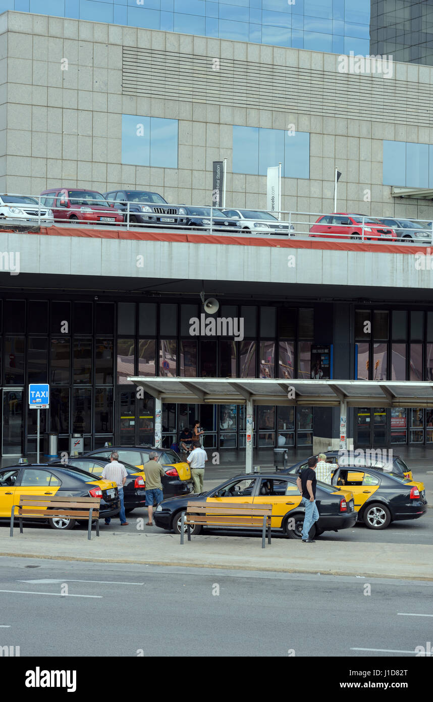 Many taxi cars are waiting riders near entrance of Sants railway station in Barcelona, Catalonia, Spain. Stock Photo