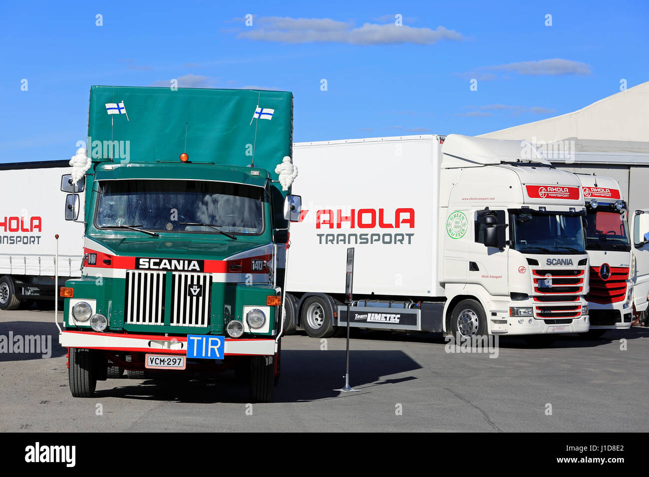 NAANTALI, FINLAND - SEPTEMBER 16; 2016: Scania LS 140, the first cargo truck of Ahola Transport in front some of the company's new fleet presented on  Stock Photo