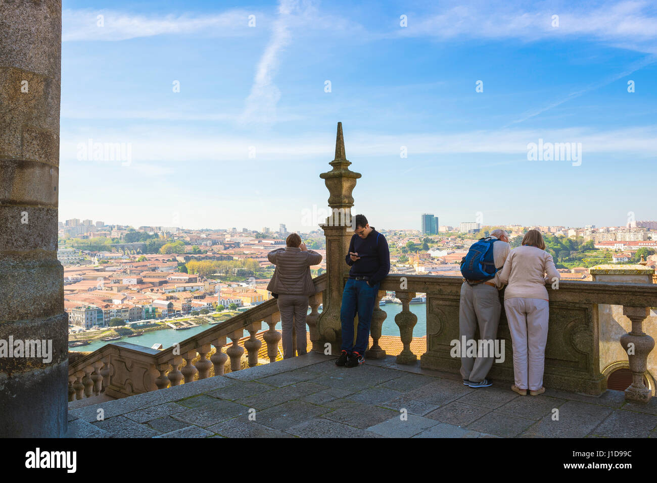 Porto Portugal, tourists view the skyline of the Gaia district from the Cathedral terrace in the centre of the old town area of Porto (Oporto), Europe Stock Photo