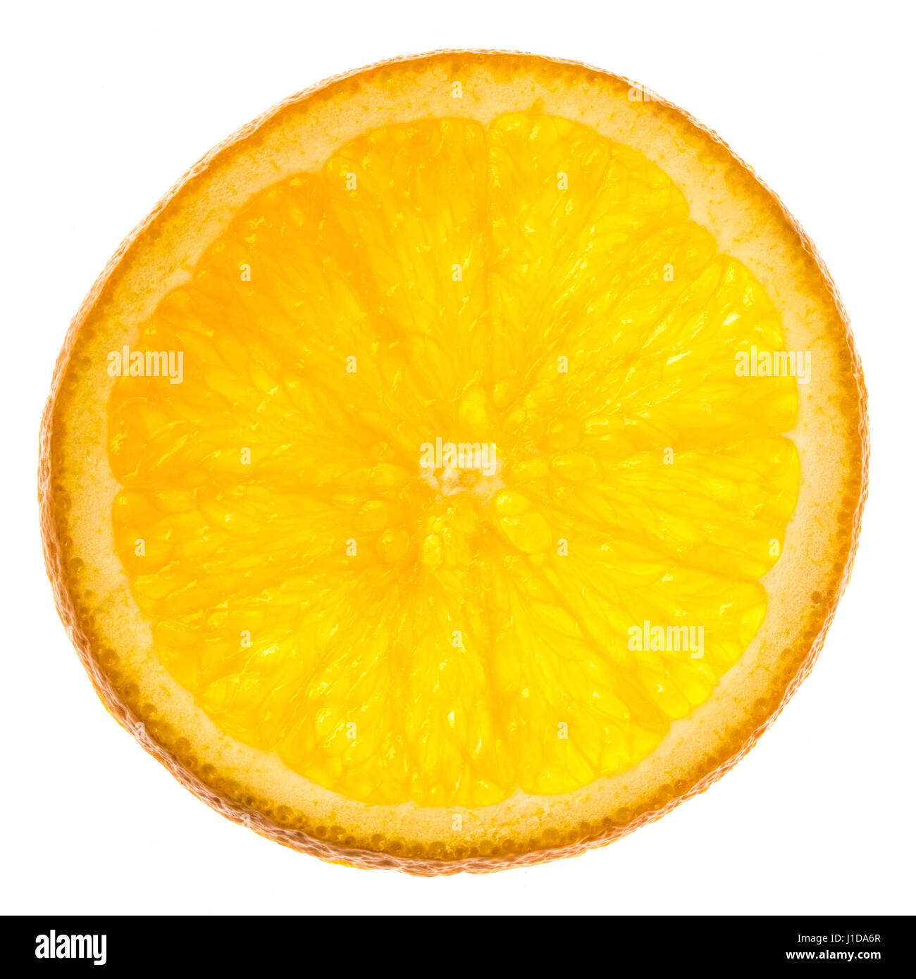 Single slice of orange fruit on white background. Stock Photo