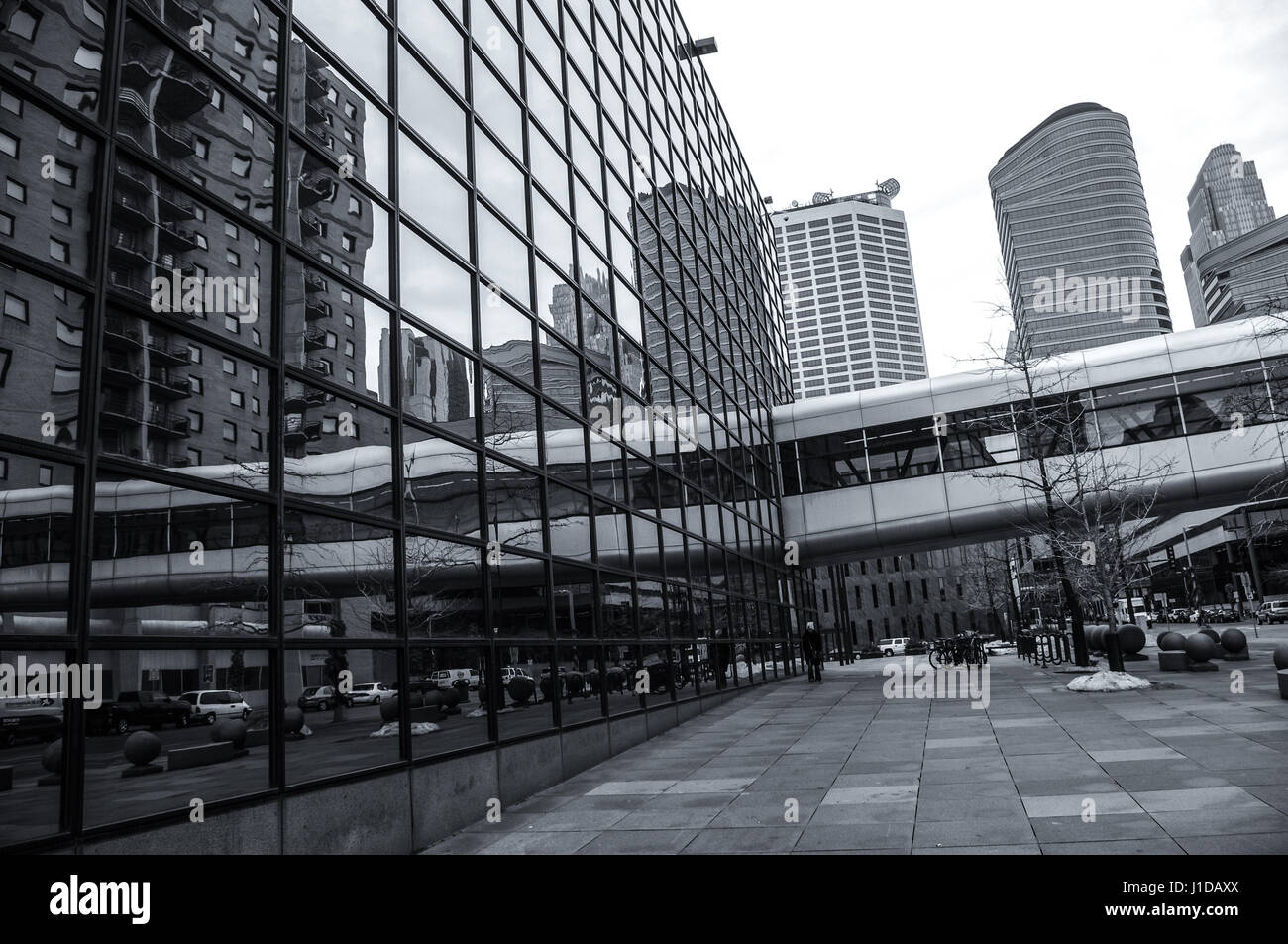 Minneapolis, USA.  Th Minneapolis building has mirrored windows which are reflecting the skyway skywalk transportation system used in winter. Stock Photo