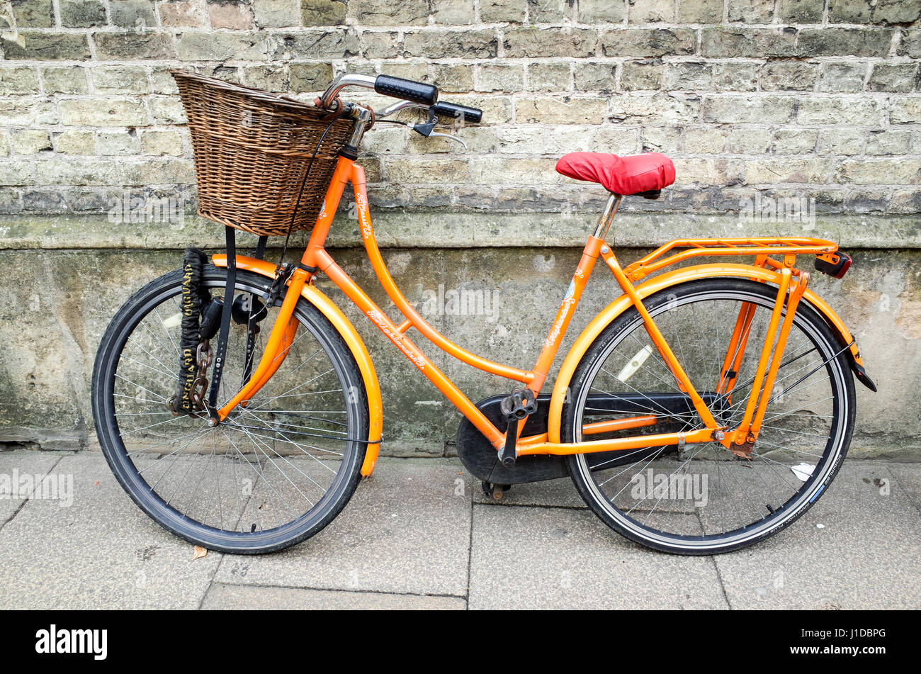 A Cambridge University Student bike leans against a College wall in the historic centre of Cambridge UK Stock Photo