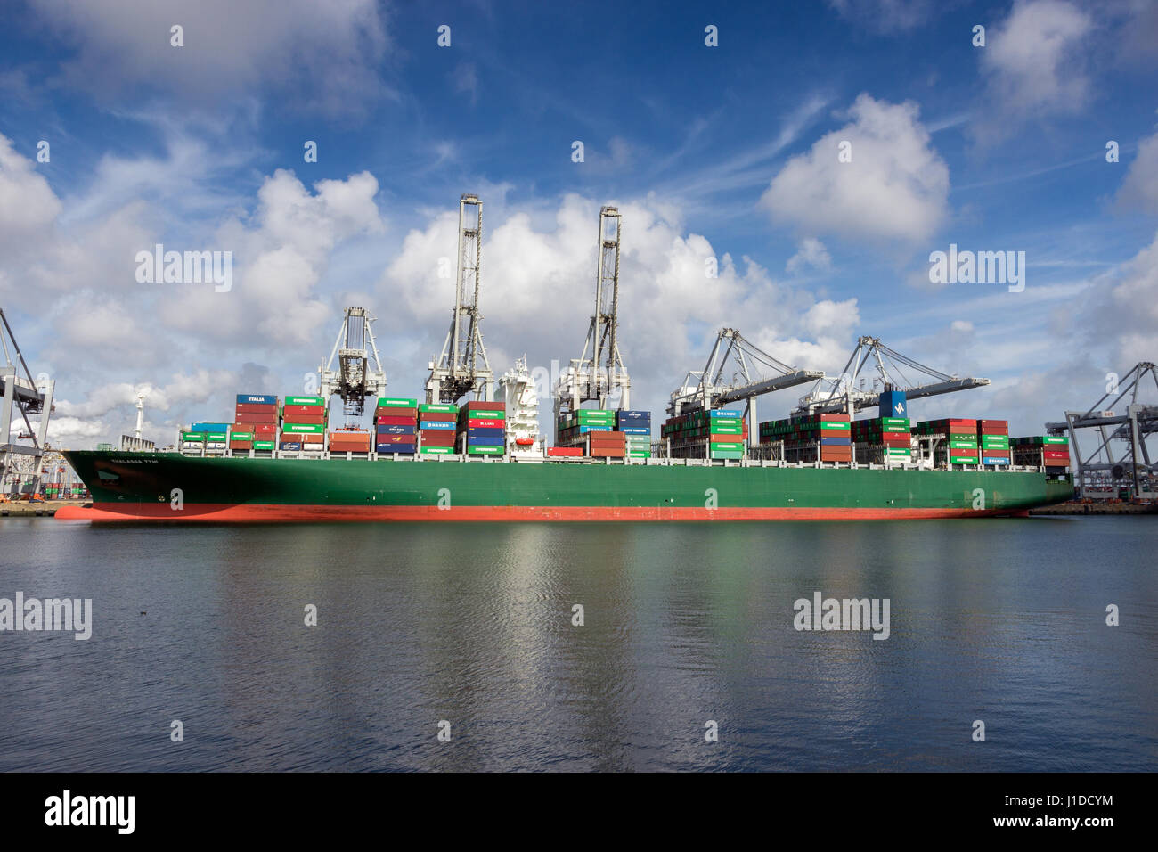 ROTTERDAM, NETHERLANDS - MAR 16, 2016: Container ship moored at the ECT container terminal in the Port of Rotterdam. Stock Photo