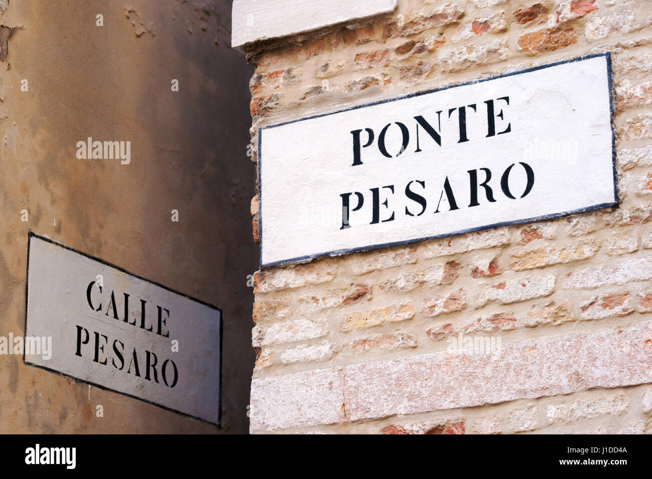 Old street signs on the houses in Venice, Italy Stock Photo