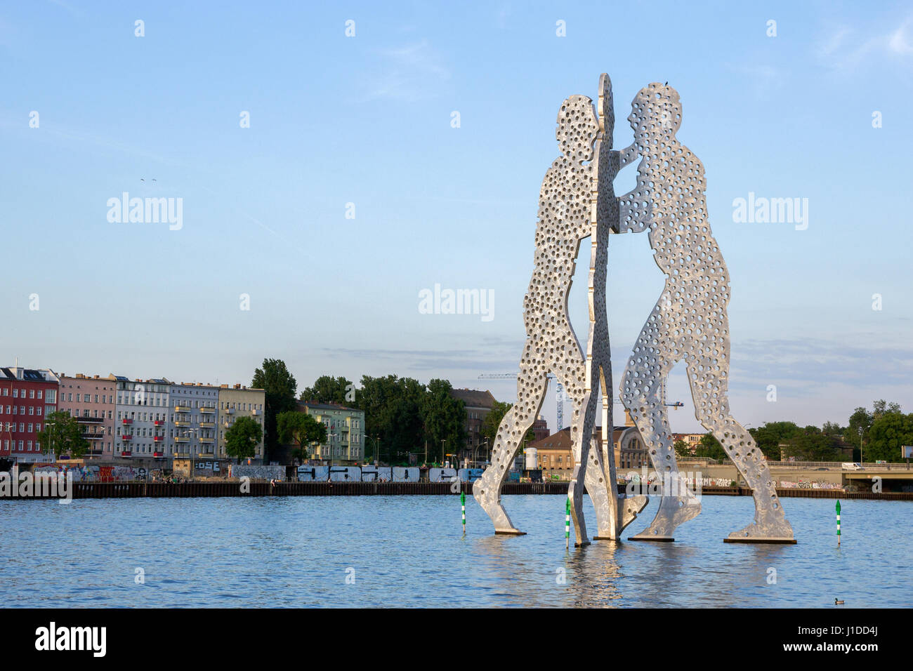 BERLIN - MAY 21, 2014: Molecule Man monument in Berlin designed by Jonathan Borofsky. Symbol of the unity of the three restructured in the 2001 distri Stock Photo